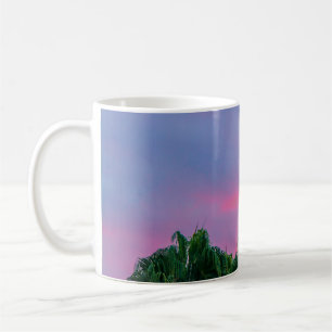 Green leaves tree under blue sky during golden hou coffee mug