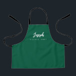 Green Little Chef Script Name personalised Kids Apron<br><div class="desc">Make your little chef feel extra special with our Green Little Chef Script Name Personalised Kids Apron. This apron is designed to provide a simple, chic, and elegant look, featuring stylish script typography for personalising the name. The purple background colour adds a touch of vibrancy and fun, perfect for engaging...</div>