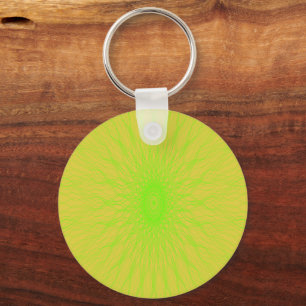 Green mandala rays on yellow keychain