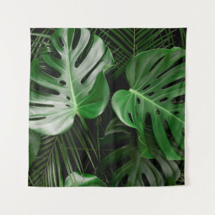 Green monstera leaves and palm leaves tapestry