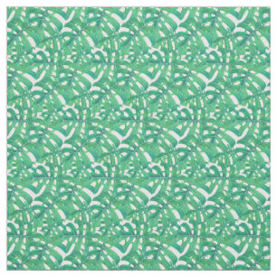 Green monstera tropical leaves pattern on white b fabric