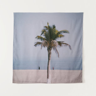 Green palm tree on seashore tapestry