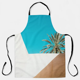 Green palm tree under blue sky in the morning apron