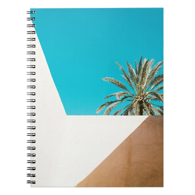 Green palm tree under blue sky in the morning notebook (Front)