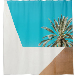 Green palm tree under blue sky in the morning shower curtain