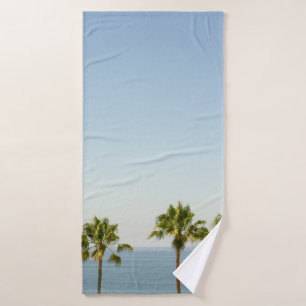 Green palm tree under white sky in the morning bath towel