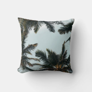 Green palm tree under white sky in the morning cushion