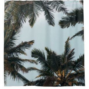 Green palm tree under white sky in the morning shower curtain