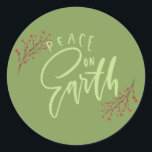 Green Peace on Earth Christmas Envelope Seals<br><div class="desc">These round stickers are perfect for sealing up your Christmas card envelopes. They feature the message "Peace on Earth" in light green against a darker green background with red winter berries accents.</div>