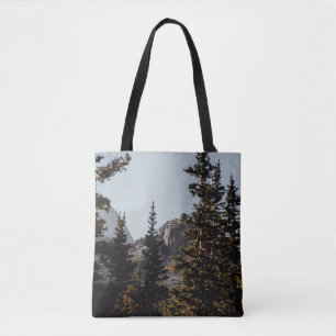 GREEN PINE TREES NEAR MOUNTAIN DURING DAYTIME TOTE BAG