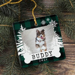Green Plaid Rustic Pine Trees Dog Bone Pet Photo Ceramic Ornament<br><div class="desc">Rustic farm fresh Christmas trees pet photo keepsake ornament. The ornament can be customised with the pet's name,  the year,  and the photo. green chequerboard plaid background with rustic pine trees and snowflakes. The pet's name is displayed on a white dog bone. Artwork by Moodthology Papery.</div>