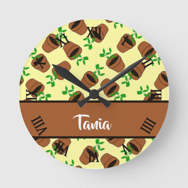 Green plant in terracotta pot on yellow round clock (Front)