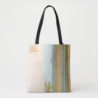 GREEN PLANT WITH CERAMIC VASE BESIDE WHITE WOODEN  TOTE BAG
