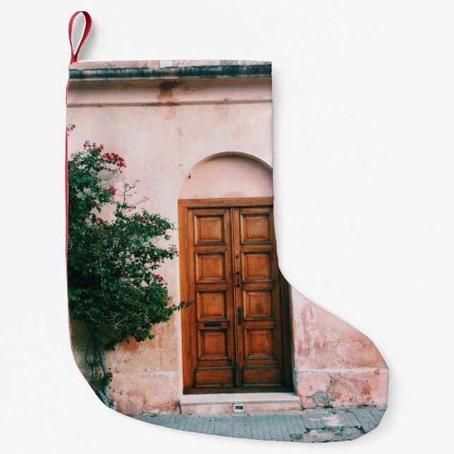 GREEN PLANTS BESIDE BROWN WOODEN DOOR SMALL CHRISTMAS STOCKING (Front)