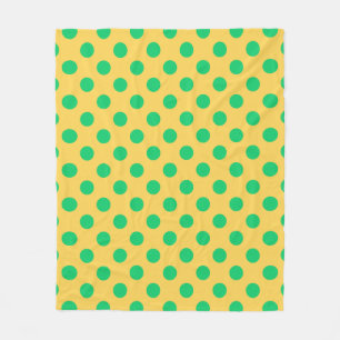Green polka dots on yellow fleece blanket