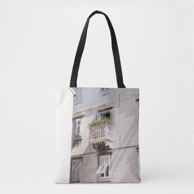 GREEN POTTED PLANT ON BROWN CONCRETE HOUSE BALCONY TOTE BAG (Front)
