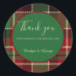 green red black scottish celtic tartan wedding classic round sticker<br><div class="desc">This wedding thank you sticker comes in different sizes, shapes and papers. It is customisable with your Intros, names and or monograms. It shows a harmonious blend of a green red black scottish pattern and it has fitting light green tones and white typography. The minimal round green overlay with a...</div>