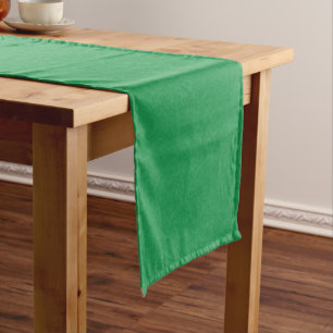 Green textured surface with swirling pattern short table runner