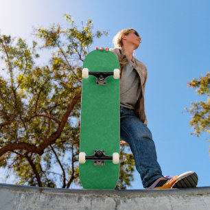 Green textured surface with  swirling pattern skateboard