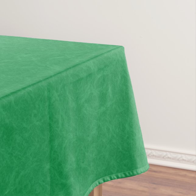 Green textured surface with  swirling pattern tablecloth (In Situ)