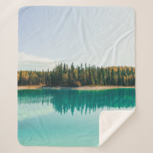 GREEN TREES BESIDE BODY OF WATER DURING DAYTIME SHERPA BLANKET