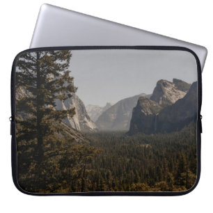 GREEN TREES NEAR MOUNTAIN DURING DAYTIME LAPTOP SLEEVE