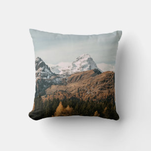 GREEN TREES NEAR SNOW COVERED MOUNTAIN DURING DAYT CUSHION