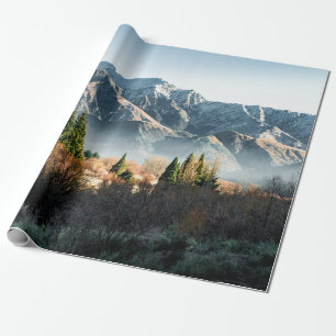GREEN TREES NEAR SNOW COVERED MOUNTAIN DURING DAYT WRAPPING PAPER