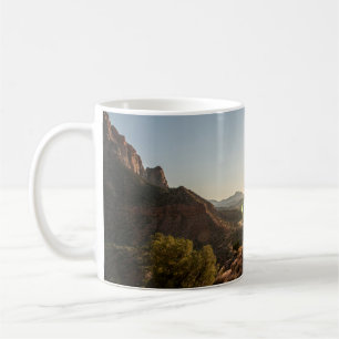 GREEN TREES ON BROWN MOUNTAIN DURING DAYTIME COFFEE MUG