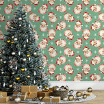 Green Vintage Santa Claus Christmas Wallpaper<br><div class="desc">Bring the magic of the holidays into your home with this green vintage Santa Claus Christmas wallpaper. Featuring charming illustrations of Santa's cheerful face and delicate snowflakes against a green background, this design adds a festive and nostalgic touch to any room. Perfect for creating a cosy and merry atmosphere, this...</div>