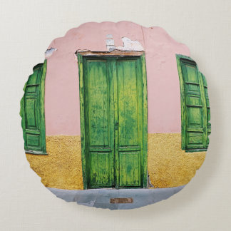 GREEN WOODEN DOOR ON WHITE CONCRETE WALL ROUND CUSHION