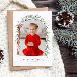 Greenery Arch & Bow Elegant Script Photo Christmas Holiday Card<br><div class="desc">Merry Christmas Red Bow on a festive arch of Pine Branch garland. This one photo Christmas Holiday card has a hand drawn pine branch botanical arch in shades of green with a red elegant bow placed on the side. Photo within Archway. Customise your Christmas greeting and family name and customise...</div>