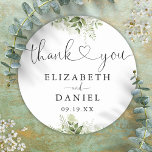 Greenery Heart Script Thank You Wedding Favour Classic Round Sticker<br><div class="desc">Elegant greenery floral heart script thank you sticker personalised with your names and special date. Designed by Thisisnotme©</div>