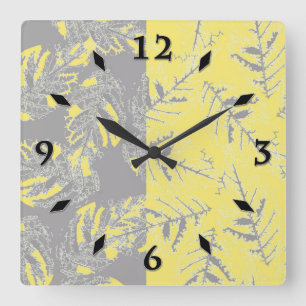 Grey and yellow leaves on a striped background. square wall clock