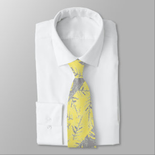 Grey and yellow leaves on a striped background.  tie
