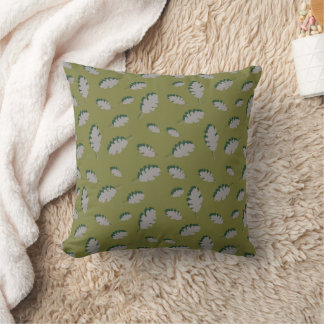 Grey autumn leaves pattern on a green background cushion