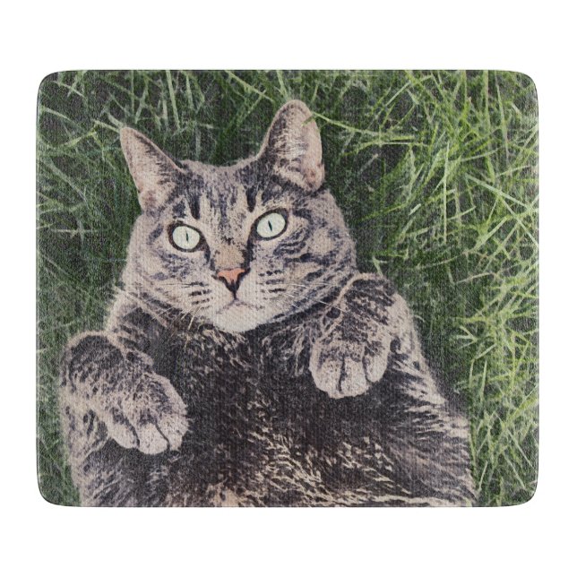 grey cat lying in the grass digital art cutting board (Front)