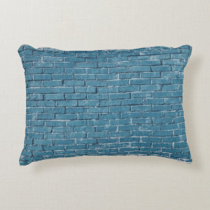 Grey concrete bricks painted in blue decorative cushion
