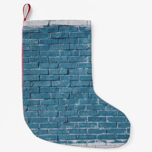 Grey concrete bricks painted in blue small christmas stocking