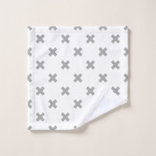 Grey cross stitches on white wash cloth