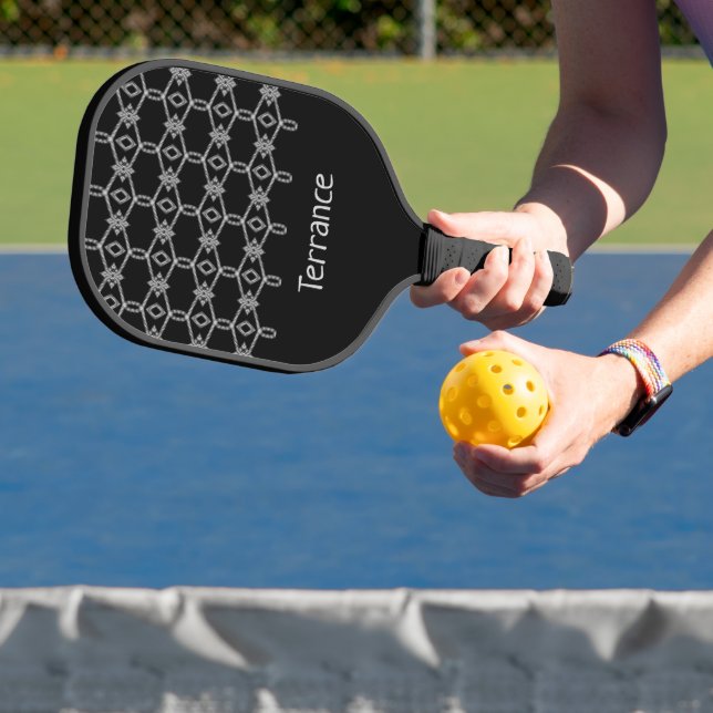 Grey decorative rope fencing black pickleball paddle (Insitu)