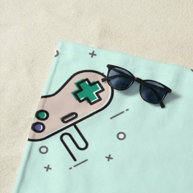 Grey game joystick on blue beach towel (In Situ)