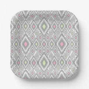 Grey, green, pink rhombuses on a white paper plate