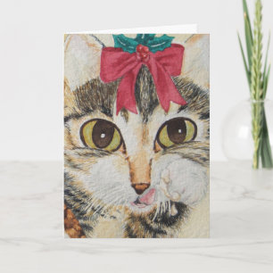 grey kitten licking paws wearing red bow christmas holiday card