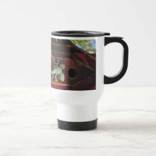 grey lizard on worn wood travel mug