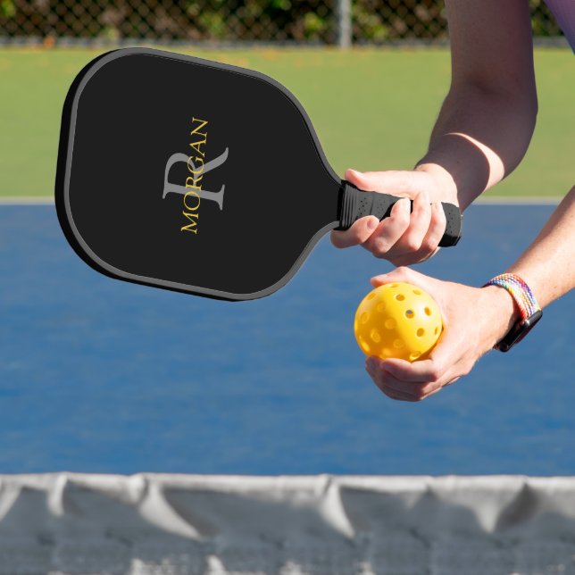 Grey Monogram & Gold Name on Black Pickleball Paddle (Insitu)