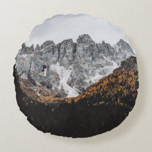 GREY ROCKY MOUNTAIN WITH TREES BELOW DAYTIME ROUND CUSHION