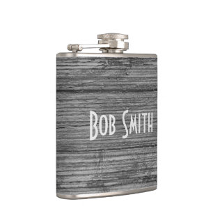 grey rustic wood background hip flask