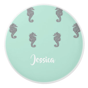 Grey seahorses on blue ceramic knob