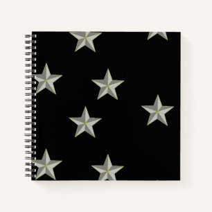 Grey stars pattern on black notebook